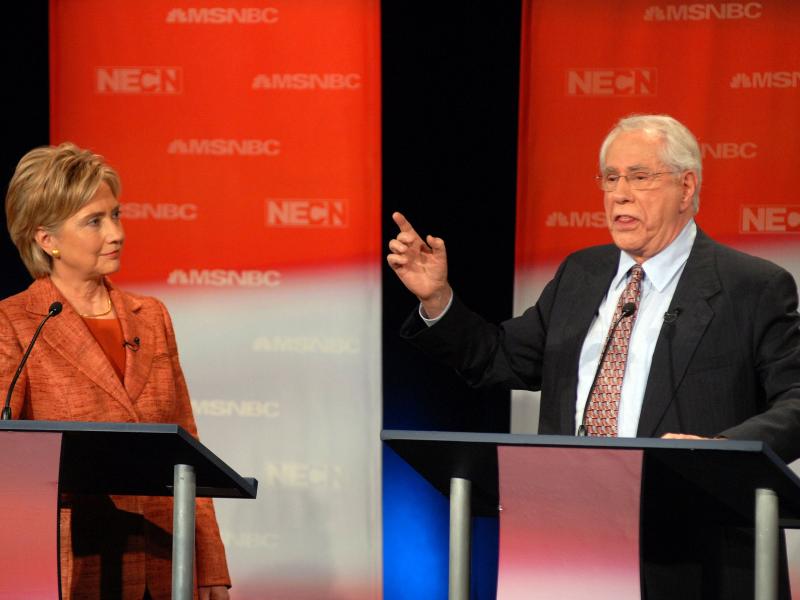 Former U.S. Sen. Mike Gravel speaks during a September 2007 Democratic presidential debate as then-Sen. Hillary Clinton listens. Former U.S. Sen. Mike Gravel speaks during a September 2007 Democratic presidential debate as then-Sen. Hillary Clinton listens.