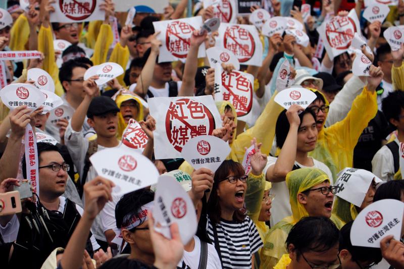 Demonstrators protest against what they called "red media" influence in Taiwan during a rally against pro-China media in front of the president's office building in Taipei on June 23. With a presidential election in January, Taiwan is bracing for a new de Demonstrators protest against what they called "red media" influence in Taiwan during a rally against pro-China media in front of the president's office building in Taipei on June 23. With a presidential election in January, Taiwan is bracing for a new de