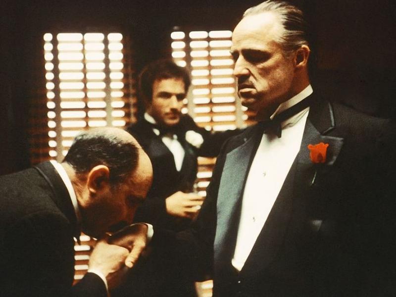 From left to right, Salvatore Corsitto as Bonasera, James Caan as Santino 'Sonny' Corleone and Marlon Brando as Don Vito Corleone in 'The Godfather'. From left to right, Salvatore Corsitto as Bonasera, James Caan as Santino 'Sonny' Corleone and Marlon Brando as Don Vito Corleone in 'The Godfather'.