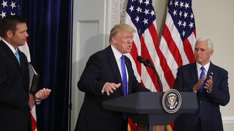 President Trump speaks while flanked by Kansas Secretary of State, Kris Kobach (left) and Vice President Pence during the first meeting of the Presidential Advisory Commission on Election Integrity in Washington, D.C., on Wednesday. President Trump speaks while flanked by Kansas Secretary of State, Kris Kobach (left) and Vice President Pence during the first meeting of the Presidential Advisory Commission on Election Integrity in Washington, D.C., on Wednesday.