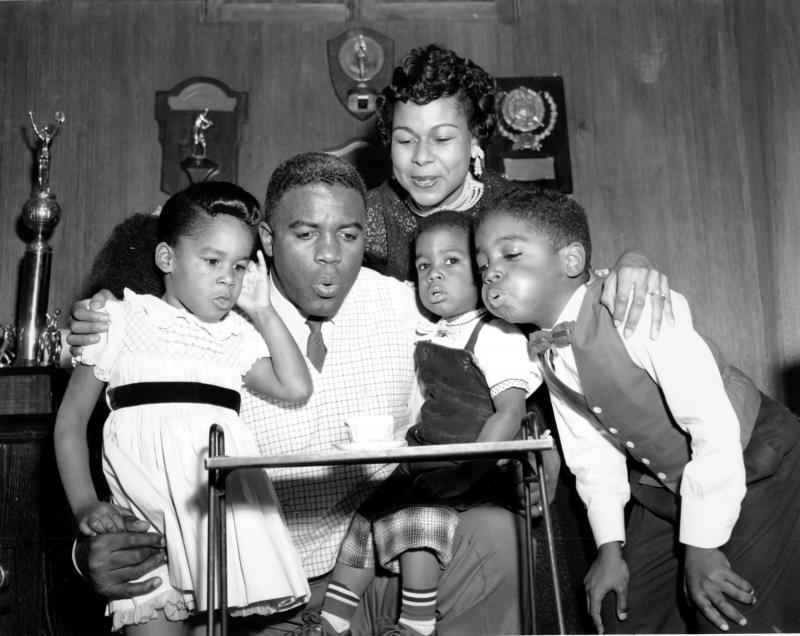 Jackie Robinson draws his family close to help him blow out a birthday candle in 1954. From left, his children Sharon, David, and Jackie Jr., with his wife Rachel, above. Jackie Robinson draws his family close to help him blow out a birthday candle in 1954. From left, his children Sharon, David, and Jackie Jr., with his wife Rachel, above.