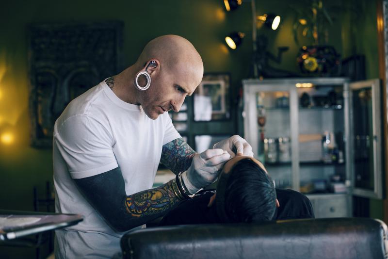 Brian Keith Thompson, owner of the Body Electric tattoo and piercing studio in Hollywood, says he is relentless in enforcing hygiene standards. Brian Keith Thompson, owner of the Body Electric tattoo and piercing studio in Hollywood, says he is relentless in enforcing hygiene standards.
