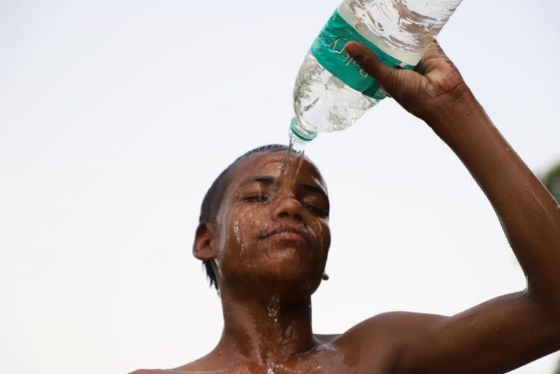 A kid tries to beat the heat in New Delhi on June 15. The changing climate is especially brutal in India. Temperatures are soaring. Asphalt roads are melting. People are dying. A kid tries to beat the heat in New Delhi on June 15. The changing climate is especially brutal in India. Temperatures are soaring. Asphalt roads are melting. People are dying.