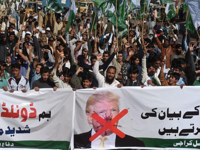 Activists of the Difa-e-Pakistan Council shout anti-U.S. slogans at a protest in Karachi on Tuesday. Pakistan summoned the U.S. ambassador after President Trump lashed out at Islamabad with threats to cut aid over "lies" about militancy. Activists of the Difa-e-Pakistan Council shout anti-U.S. slogans at a protest in Karachi on Tuesday. Pakistan summoned the U.S. ambassador after President Trump lashed out at Islamabad with threats to cut aid over "lies" about militancy.