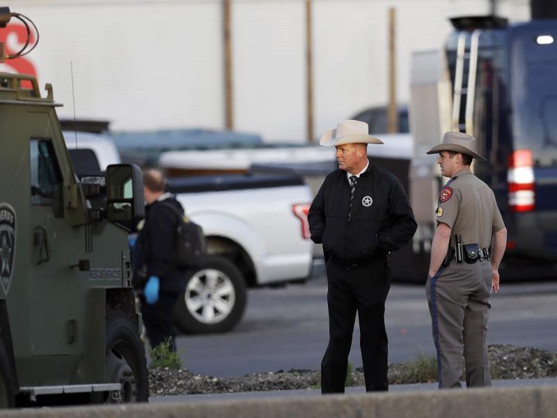 Officials investigate the scene in Round Rock, Texas, where a suspect in a series of bombing attacks in Austin blew himself up early Wednesday as authorities closed in. Officials investigate the scene in Round Rock, Texas, where a suspect in a series of bombing attacks in Austin blew himself up early Wednesday as authorities closed in.