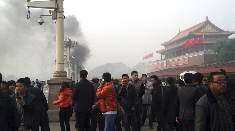 Smoke rises from Tiananmen Square in Beijing on Oct. 28, when three Uighurs, a mostly Muslim ethnic minority, drove a jeep into a crowd there, killing two tourists. The people inside the car died as well, after they set their vehicle on fire. Smoke rises from Tiananmen Square in Beijing on Oct. 28, when three Uighurs, a mostly Muslim ethnic minority, drove a jeep into a crowd there, killing two tourists. The people inside the car died as well, after they set their vehicle on fire.