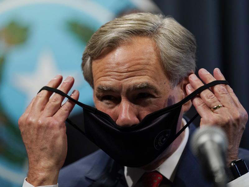 Texas Gov. Greg Abbott, seen here donning a mask in September, announced Tuesday he will lift the state's mask mandate. Texas Gov. Greg Abbott, seen here donning a mask in September, announced Tuesday he will lift the state's mask mandate.
