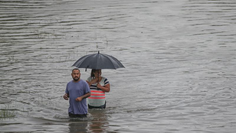People in Houston navigate the floodwaters on Thursday. The city got more than 9 inches of rain on that day alone, according to the National Weather Service in Houston. People in Houston navigate the floodwaters on Thursday. The city got more than 9 inches of rain on that day alone, according to the National Weather Service in Houston.