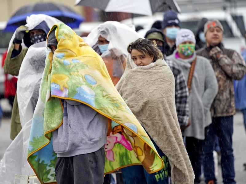 People wait in line to fill propane tanks on Feb. 17 in Houston. Power grid problems left millions weathering conditions in the dark in uninsulated homes, intensifying the Texas winter storm's deadliness. People wait in line to fill propane tanks on Feb. 17 in Houston. Power grid problems left millions weathering conditions in the dark in uninsulated homes, intensifying the Texas winter storm's deadliness.