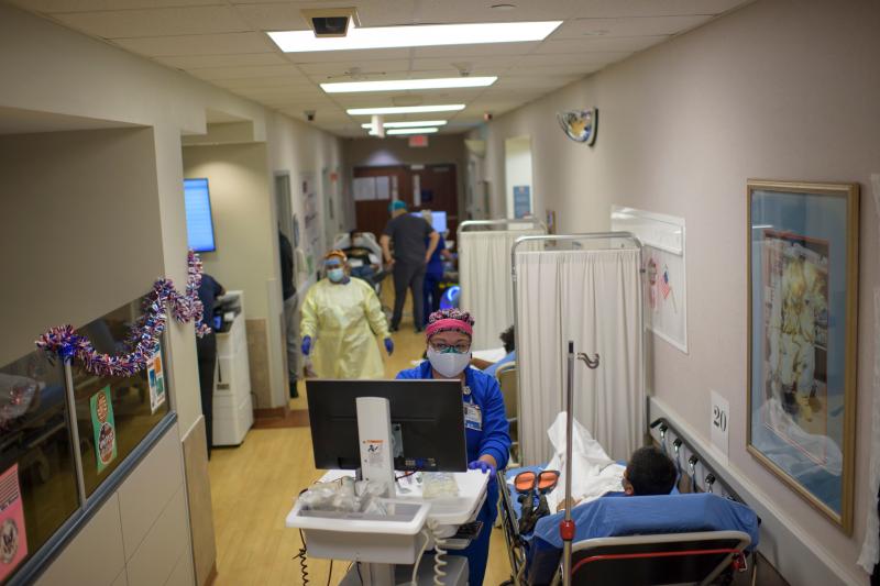 A health care worker talks to a patient in the emergency room at OakBend Medical Center in Richmond, Texas, on July 15. A health care worker talks to a patient in the emergency room at OakBend Medical Center in Richmond, Texas, on July 15.
