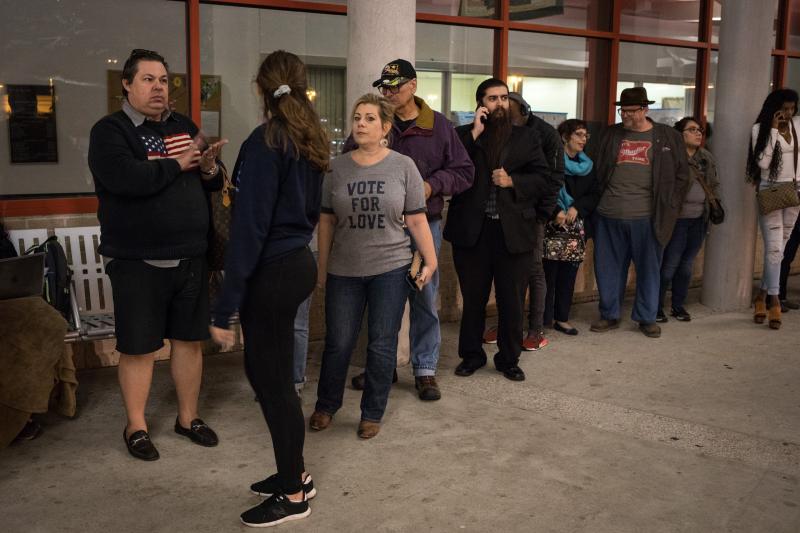 People lined up to vote early at a Houston polling place in October 2018. People lined up to vote early at a Houston polling place in October 2018.