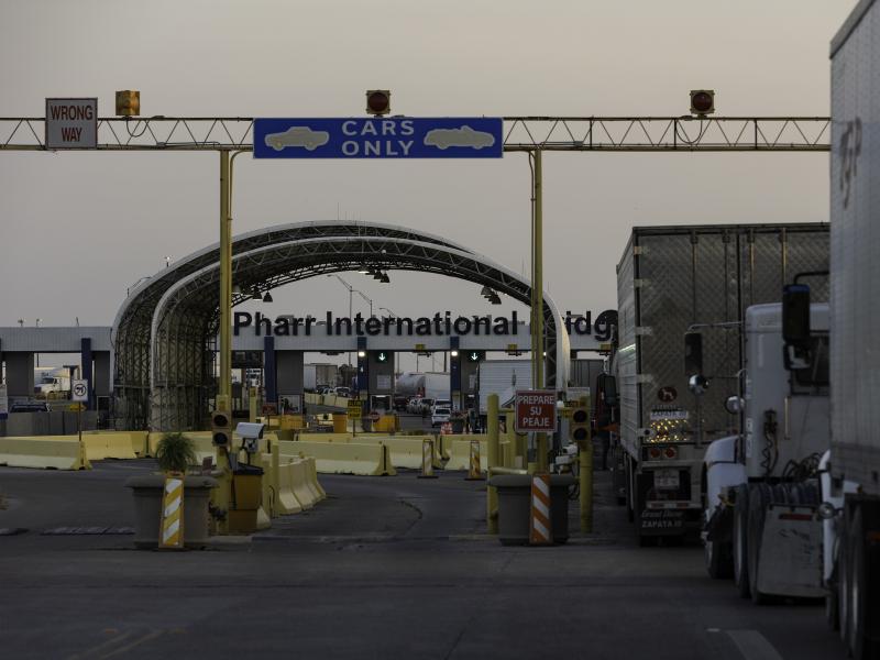 Several dozen commercial trucks wait to cross the Pharr-Reynosa International bridge on April 13 in Pharr, Texas. Several dozen commercial trucks wait to cross the Pharr-Reynosa International bridge on April 13 in Pharr, Texas.