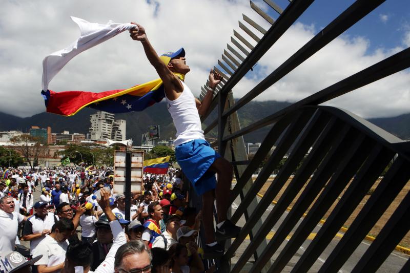 Supporters of Venezuelan opposition leader Juan Guaidó take part in a march in Caracas in February 2019. Amid Venezuela's isolation and catastrophic economic conditions, Guaidó emerged as a key challenger to Nicolás Maduro's rule, but has had difficult Supporters of Venezuelan opposition leader Juan Guaidó take part in a march in Caracas in February 2019. Amid Venezuela's isolation and catastrophic economic conditions, Guaidó emerged as a key challenger to Nicolás Maduro's rule, but has had difficult