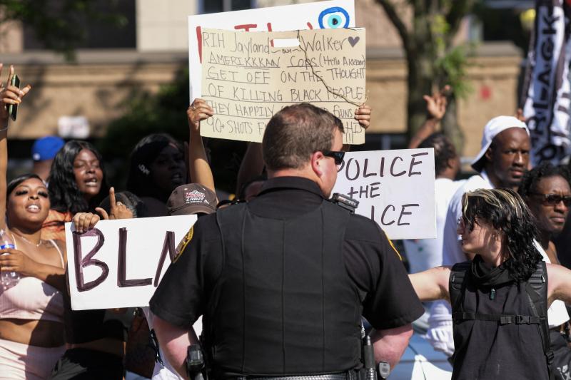 Demonstrators standoff with officers outside Akron City Hall on Sunday as they protest the fatal police shooting of Jayland Walker. Demonstrators standoff with officers outside Akron City Hall on Sunday as they protest the fatal police shooting of Jayland Walker.