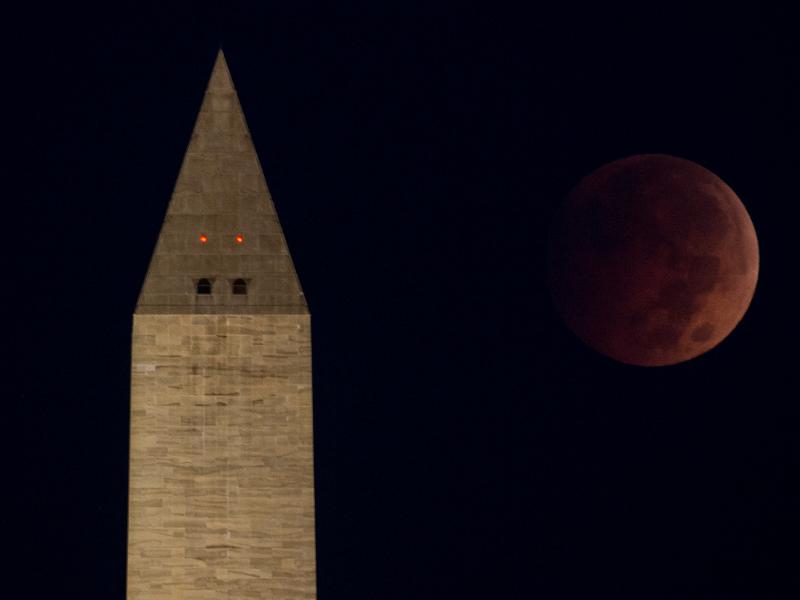 The "blood moon" eclipse above the Washington Monument just before dawn on the National Mall, in Washington, D.C. The "blood moon" eclipse above the Washington Monument just before dawn on the National Mall, in Washington, D.C.