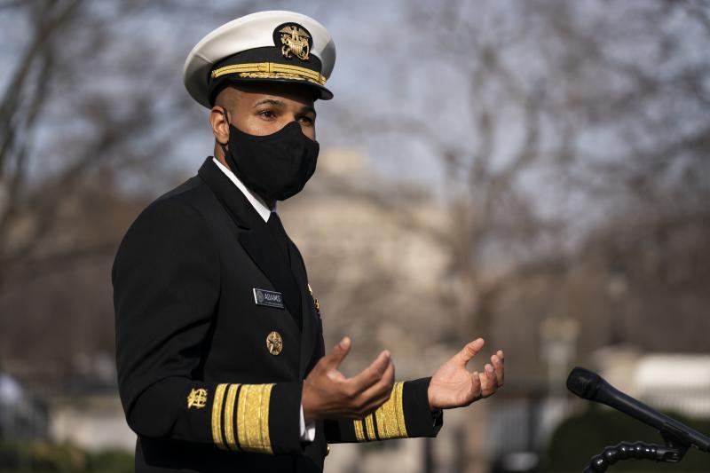 Dr. Jerome Adams, then the U.S. surgeon general, talks to reporters at the White House in December. Dr. Jerome Adams, then the U.S. surgeon general, talks to reporters at the White House in December.