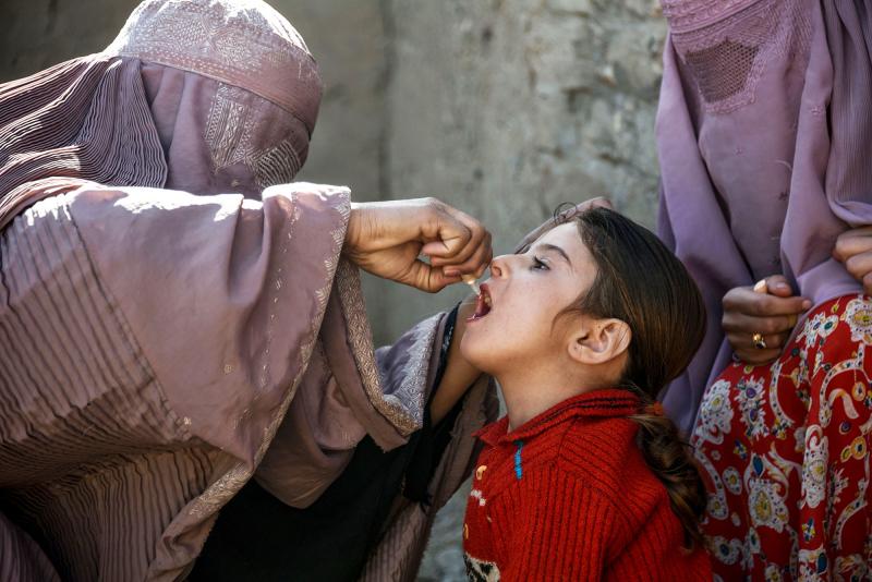 A health worker administers a polio vaccine to a child in Afghanistan's Kandahar province. Taliban opposition to vaccine campaigns have left millions of children unprotected against the virus. A health worker administers a polio vaccine to a child in Afghanistan's Kandahar province. Taliban opposition to vaccine campaigns have left millions of children unprotected against the virus.