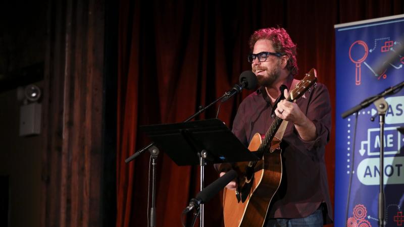 House musician Jonathan Coulton leads a music parody game on Ask Me Another at the Bell House in Brooklyn, New York. House musician Jonathan Coulton leads a music parody game on Ask Me Another at the Bell House in Brooklyn, New York.