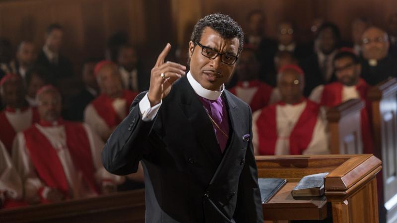 In Come Sunday, Chiwetel Ejiofor plays Carlton Pearson, a real-life megachurch leader who experiences a crisis of faith. In Come Sunday, Chiwetel Ejiofor plays Carlton Pearson, a real-life megachurch leader who experiences a crisis of faith.
