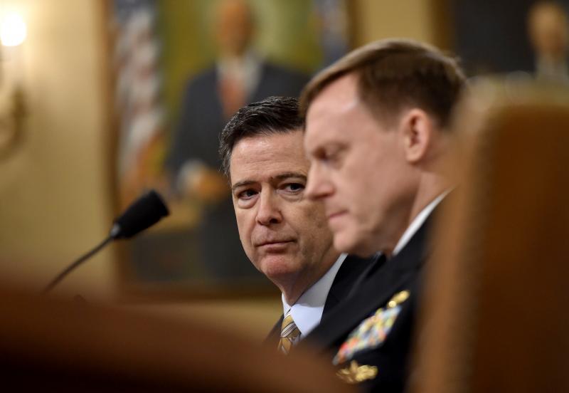 FBI Director James Comey and National Security Agency Director Mike Rogers testify during the House Permanent Select Committee on Intelligence hearing on Russian actions during the 2016 election campaign. FBI Director James Comey and National Security Agency Director Mike Rogers testify during the House Permanent Select Committee on Intelligence hearing on Russian actions during the 2016 election campaign.