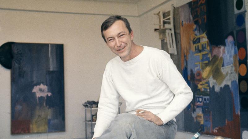 Jasper Johns, pictured in his New York City studio in 1964, was known for transforming common objects like flags, numerals and archery targets into unsettling paintings. Jasper Johns, pictured in his New York City studio in 1964, was known for transforming common objects like flags, numerals and archery targets into unsettling paintings.