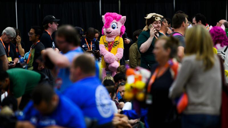 Fans wait in line for the opening ceremony at BronyCon 2019. Fans wait in line for the opening ceremony at BronyCon 2019.