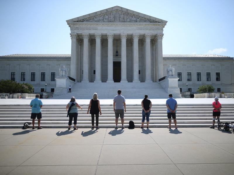 Demonstrators pray in front of the U.S. Supreme Court on July 8, a day the court ruled that employers with religious objections can decline to provide contraception coverage under the Affordable Care Act. With the death of Ruth Bader Ginsburg, the ACA's f Demonstrators pray in front of the U.S. Supreme Court on July 8, a day the court ruled that employers with religious objections can decline to provide contraception coverage under the Affordable Care Act. With the death of Ruth Bader Ginsburg, the ACA's f