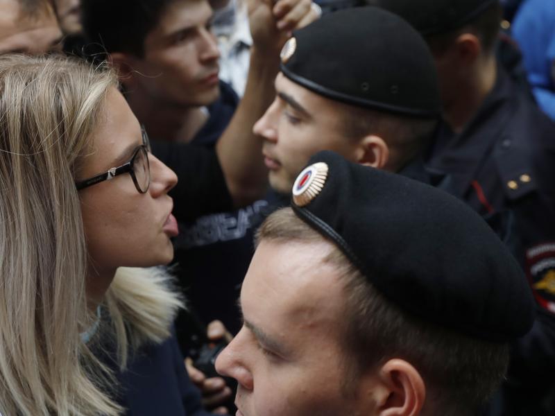 Russian opposition candidate and lawyer Lyubov Sobol stands in front of police during a demonstration in Moscow on July 14. This summer's wave of opposition protests has pushed Sobol to the forefront of the Russian political scene. Russian opposition candidate and lawyer Lyubov Sobol stands in front of police during a demonstration in Moscow on July 14. This summer's wave of opposition protests has pushed Sobol to the forefront of the Russian political scene.