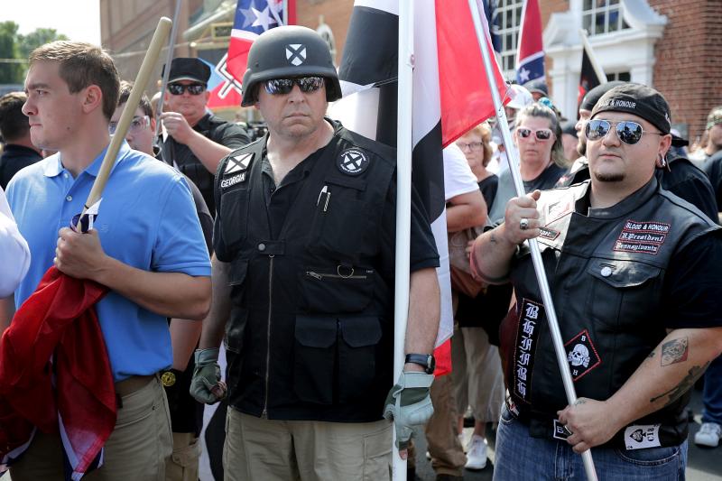 Hundreds of white nationalists, neo-Nazis and members of the "alt-right" march down East Market Street toward Emancipation Park during the "Unite the Right" rally August 12, 2017 in Charlottesville, Virginia. Hundreds of white nationalists, neo-Nazis and members of the "alt-right" march down East Market Street toward Emancipation Park during the "Unite the Right" rally August 12, 2017 in Charlottesville, Virginia.