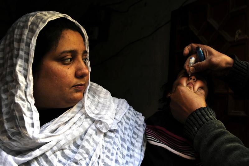 During nationwide polio campaigns, hundreds of thousands of health workers go door to door, giving children two drops of the polio vaccine. During nationwide polio campaigns, hundreds of thousands of health workers go door to door, giving children two drops of the polio vaccine.