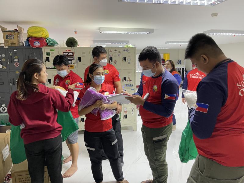 Staffers distribute the required personal protective gear before they transfer a COVID-positive patient to a hospital. They'll wear a gown, gloves, mask and face shield. Staffers distribute the required personal protective gear before they transfer a COVID-positive patient to a hospital. They'll wear a gown, gloves, mask and face shield.