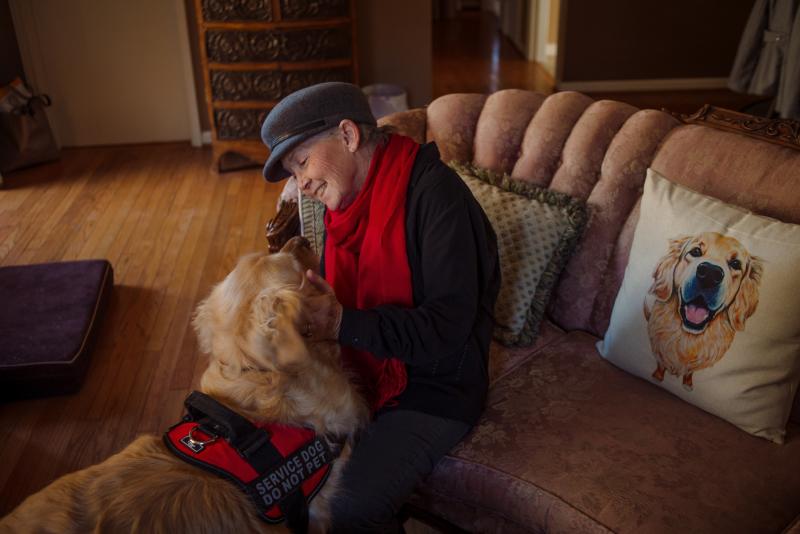 Peggy Gibson sits in her living room with her service dog, Rocky, in West Jefferson, N.C., last November. Gibson says Rocky, a diabetic alert dog, isn't able to work well in public. Peggy Gibson sits in her living room with her service dog, Rocky, in West Jefferson, N.C., last November. Gibson says Rocky, a diabetic alert dog, isn't able to work well in public.