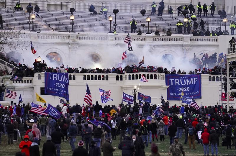 In this Wednesday, Jan. 6, 2021, file photo, rioters storm the Capitol, in Washington. In the weeks since the attacks lawmakers from both parties have clashed over creating an outside commission to investigate the riot. In this Wednesday, Jan. 6, 2021, file photo, rioters storm the Capitol, in Washington. In the weeks since the attacks lawmakers from both parties have clashed over creating an outside commission to investigate the riot.