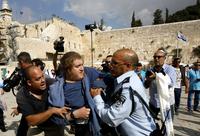Israeli police detain a right-wing Jewish activist near the Western Wall after he tried to enter the Temple Mount/Noble Sanctuary compound in Jerusalem on Oct. 30. Israeli authorities temporarily closed the compound because of tensions over the site, whic Israeli police detain a right-wing Jewish activist near the Western Wall after he tried to enter the Temple Mount/Noble Sanctuary compound in Jerusalem on Oct. 30. Israeli authorities temporarily closed the compound because of tensions over the site, whic