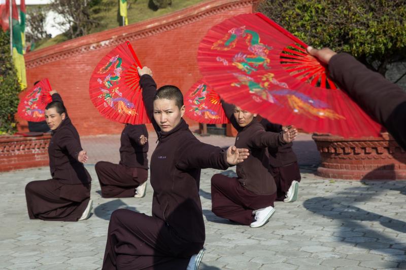 Nuns practice kung fu as a part of their daily routine at Druk Amitabha Mountain nunnery in Kathmandu, Nepal. Nuns practice kung fu as a part of their daily routine at Druk Amitabha Mountain nunnery in Kathmandu, Nepal.