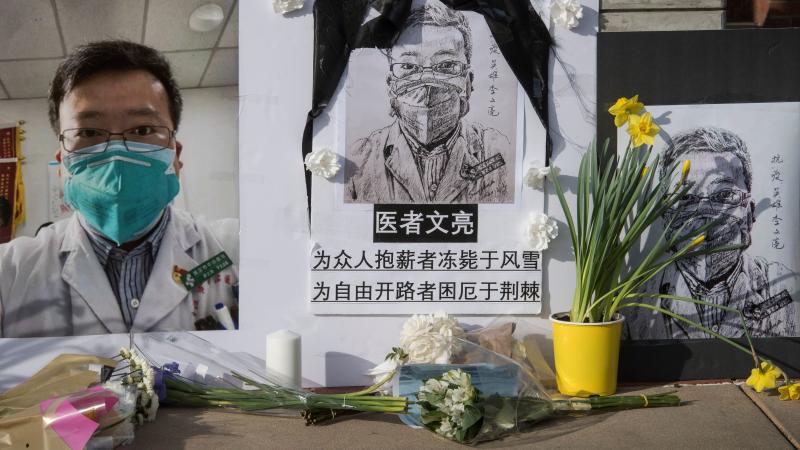 A memorial pays tribute to Dr. Li Wenliang, who called attention to the coronavirus in China, on UCLA's campus in February in Westwood, Calif. The doctor's widow, Fu Xuejie, announced the birth of their boy on Friday. A memorial pays tribute to Dr. Li Wenliang, who called attention to the coronavirus in China, on UCLA's campus in February in Westwood, Calif. The doctor's widow, Fu Xuejie, announced the birth of their boy on Friday.