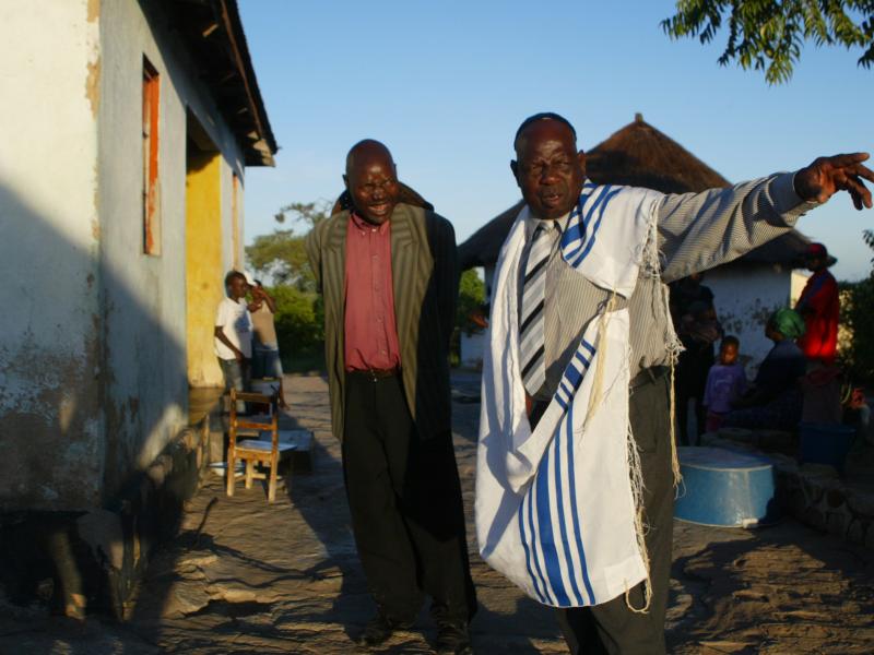 A leader of the Lemba people, wearing a prayer shawl, gathers with his fellow Jews. DNA tests have confirmed the Semitic heritage of these sub-Saharan Africans. A leader of the Lemba people, wearing a prayer shawl, gathers with his fellow Jews. DNA tests have confirmed the Semitic heritage of these sub-Saharan Africans.
