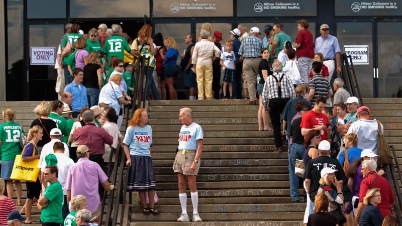 Voters line up outside the Hilton Coliseum at Iowa State University on Aug. 13, 2011, to vote in the Iowa Straw Poll. Voters line up outside the Hilton Coliseum at Iowa State University on Aug. 13, 2011, to vote in the Iowa Straw Poll.