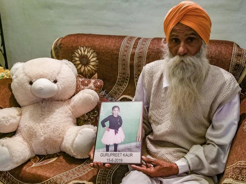 Gurmeet Singh holds a photo of his granddaughter, Gurupreet Kaur, who died of heatstroke in Arizona in June 2019. The 6-year-old and her mother had just crossed into the U.S. from Mexico. Gurmeet Singh holds a photo of his granddaughter, Gurupreet Kaur, who died of heatstroke in Arizona in June 2019. The 6-year-old and her mother had just crossed into the U.S. from Mexico.