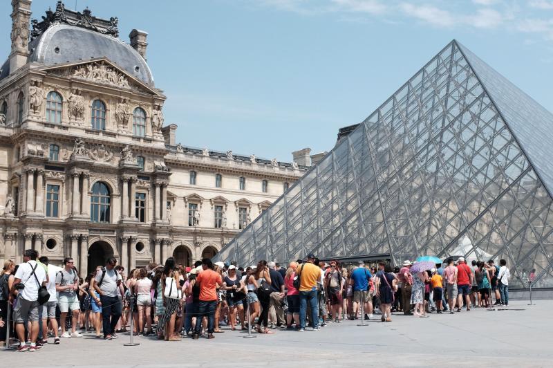 The Louvre was closed on Monday as security and reception staff went on strike over what they say are deteriorating working conditions as the museum draws record crowds. Here, visitors queue outside the Louvre in July 2015. The Louvre was closed on Monday as security and reception staff went on strike over what they say are deteriorating working conditions as the museum draws record crowds. Here, visitors queue outside the Louvre in July 2015.