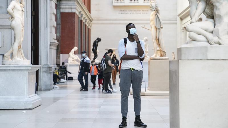 Visitors wear masks at the Metropolitan Museum of Art in October. The museum's director says the Met is considering selling art to pay for operating expenses. Visitors wear masks at the Metropolitan Museum of Art in October. The museum's director says the Met is considering selling art to pay for operating expenses.