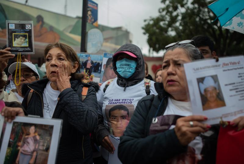 People who gathered in Poza Rico last month brought with them posters, T-shirts and jewelry bearing the images of their missing loved ones. People who gathered in Poza Rico last month brought with them posters, T-shirts and jewelry bearing the images of their missing loved ones.