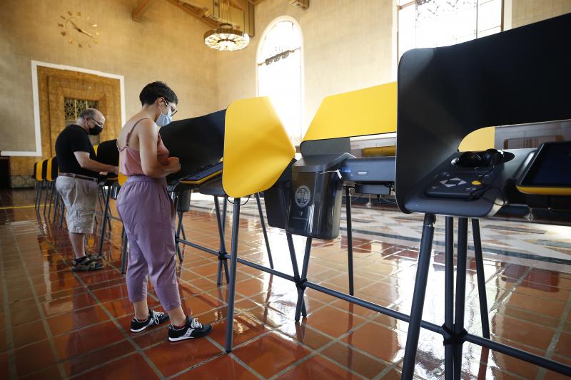 Josh Hodas and partner Serena Delgadillo cast their votes in the historic Los Angeles Union Station Ticket Hall on Monday. Josh Hodas and partner Serena Delgadillo cast their votes in the historic Los Angeles Union Station Ticket Hall on Monday.