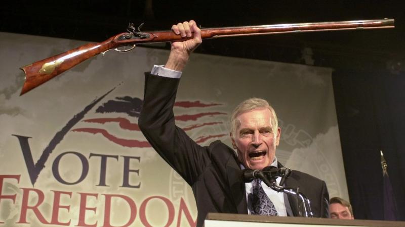 The late Charlton Heston, the former actor and head of the National Rifle Association, addresses gun owners during a "get-out-the-vote" rally in New Hampshire in October 2002. The late Charlton Heston, the former actor and head of the National Rifle Association, addresses gun owners during a "get-out-the-vote" rally in New Hampshire in October 2002.