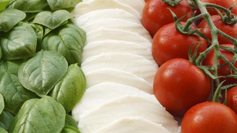 The Italian flag made up of three ingredients that help form the base of the country's cuisine: basil, mozzarella and tomatoes. The Italian flag made up of three ingredients that help form the base of the country's cuisine: basil, mozzarella and tomatoes.