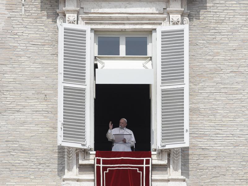 Pope Francis delivers his blessing during the noon prayer from the window of his studio overlooking St.Peter's Square on Sunday. Francis told the crowd that before his address, he had been stuck in an elevator for 25 minutes, causing him to be late. Pope Francis delivers his blessing during the noon prayer from the window of his studio overlooking St.Peter's Square on Sunday. Francis told the crowd that before his address, he had been stuck in an elevator for 25 minutes, causing him to be late.