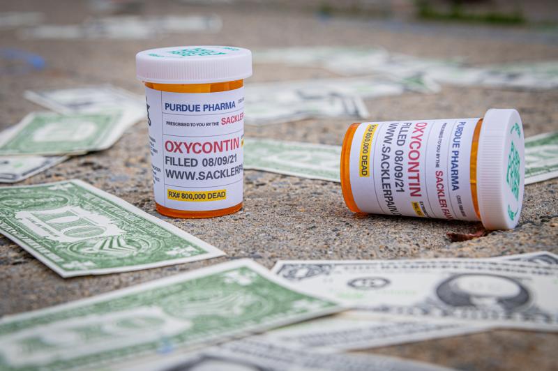 Demonstrators scattered fake money and prescription bottles of OxyContin outside of The United States Bankruptcy Court in response to the overdose crisis. Demonstrators scattered fake money and prescription bottles of OxyContin outside of The United States Bankruptcy Court in response to the overdose crisis.