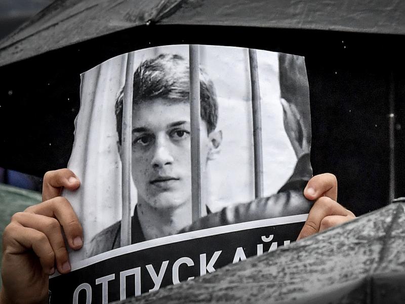 A protester holds a poster reading "Free Yegor Zhukov!" during an August rally in Moscow, after mass police detentions. He was arrested in Moscow on Aug. 1. A protester holds a poster reading "Free Yegor Zhukov!" during an August rally in Moscow, after mass police detentions. He was arrested in Moscow on Aug. 1.
