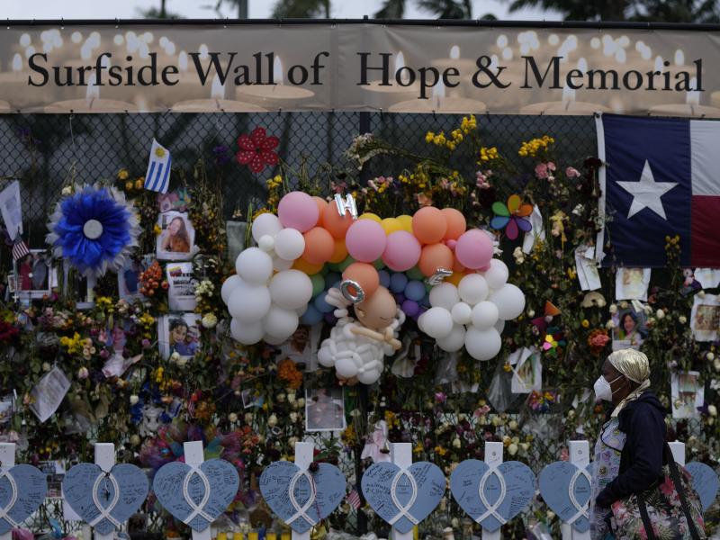 A makeshift memorial pays tribute to the victims of the Champlain Towers South building collapse in Surfside, Fla. A makeshift memorial pays tribute to the victims of the Champlain Towers South building collapse in Surfside, Fla.