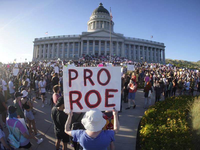 People attend an abortion-rights protest at the Utah State Capitol in Salt Lake City on Friday after the U.S. Supreme Court overturned Roe v. Wade. People attend an abortion-rights protest at the Utah State Capitol in Salt Lake City on Friday after the U.S. Supreme Court overturned Roe v. Wade.